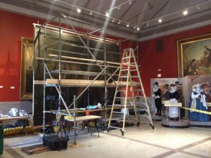 Placed in its enormous "easel" with scaffolding set to allow access, the painting is ready for stabilization and cleaning